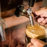 Bartender Filling Glass With Craft Beer